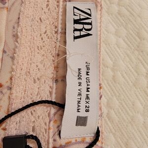 Zara mid length silky skirt. Size M. Soft pink with paisley pattern.